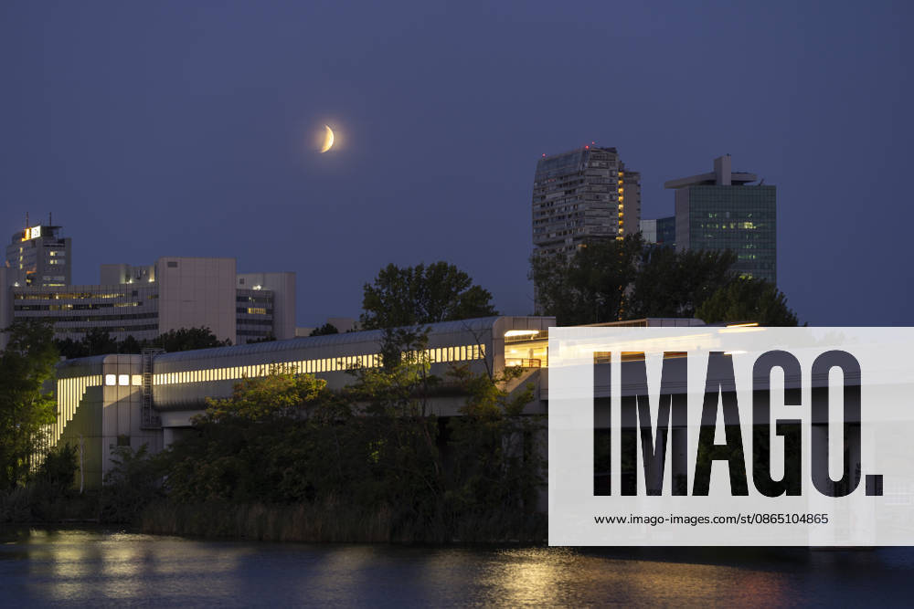 Moon during partial eclipse seen from Austrias capital Vienna, in frame is the subway station Alte Donau. Vienna Vienna Austria