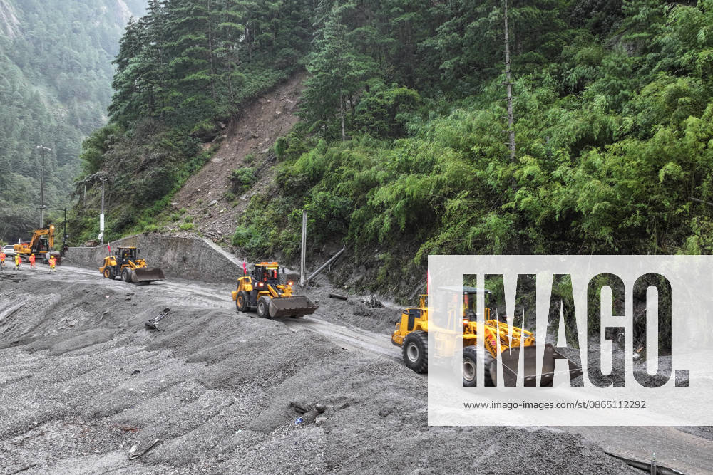 Excavators and loaders move towards a damaged road section to begin debris clearance operations on August 28, 2026 in Shigatse, Xizang Autonomous Region of China. Traffic departments have organized forces to carry out emergency repair work on the affected section of National Highway G216 leading to Gyirong Port following a mudslide on the Nepal side on August 26 that caused casualties and missing persons.