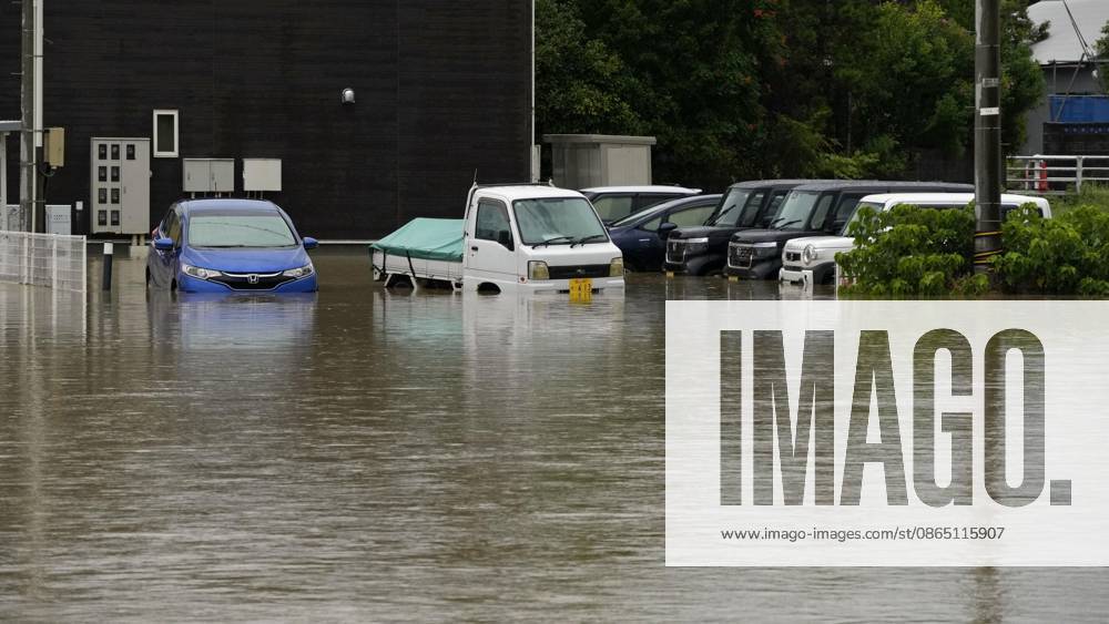 Torrential rain in central Japan Photo taken Aug. 27, 2026, shows submerged vehicles in Himi in Toyama Prefecture, central Japan, following torrential rain. A14AA0005626701P