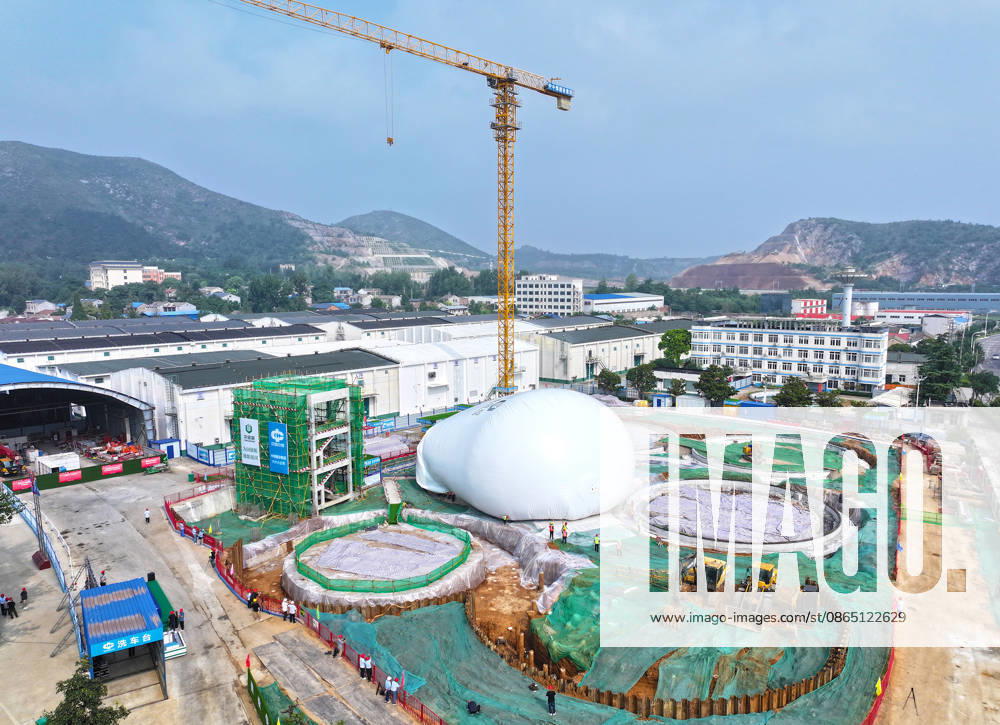 Workers conduct the first inflation operation for an air dome grain storage silo at the construction site of the Central Reserve Grain Huaibei Direct Storage Depot project on August 28, 2026 in Huaibei, Anhui Province of China. The facility is described as the largest air dome grain storage complex in China.