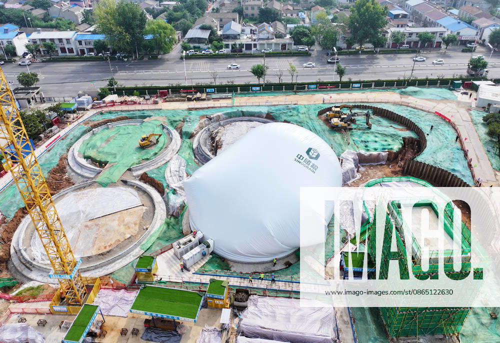 Workers conduct inflation operations for the first air dome warehouse at the construction site of the Central Reserve Grain Huaibei Direct Depot project on August 28, 2026 in Huaibei, Anhui Province of China. The project is described as the largest air dome grain storage complex in the country.