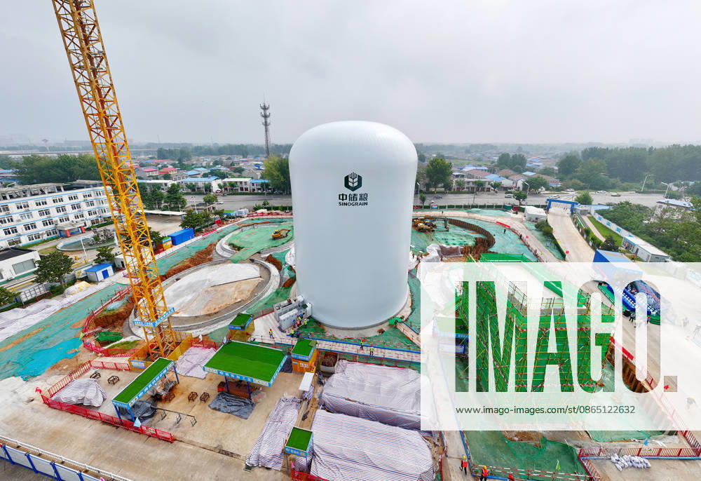 Workers conduct the first air membrane inflation operation at the construction site of the Central Reserve Grain Huaibei Direct Depot air membrane silo project on August 28, 2026 in Huaibei, Anhui Province of China. The facility is reported to be the largest air membrane grain silo group in the country.