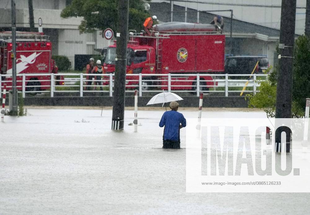 Torrential rain in central Japan A person wades down a submerged street in Himi in Toyama Prefecture, central Japan, on Aug. 28, 2026, following torrential rain. A14AA0005626748P