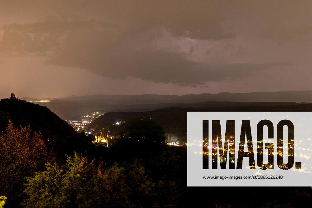 Thunderstorm clouds over the Eifel—View from Petersberg, August 28, 2026—View from Petersberg near Königswinter at night, showing approaching thunderstorm clouds coming from the direction of the Eifel; in the background on the left are the Drachenfels castle ruins, with Oberwinter behind them, Rolandseck; on the right, Mehlem and Wachtberg; Königswinter; Petersberg; North Rhine-Westphalia; Germany