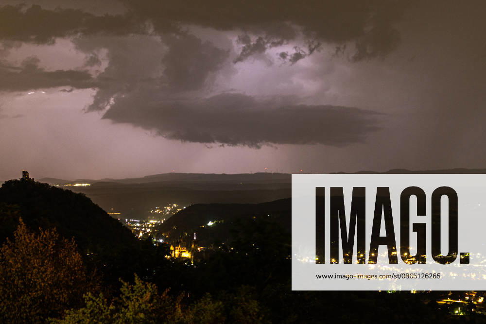 Thunderstorm clouds over the Eifel—View from Petersberg, August 28, 2026—View from Petersberg near Königswinter at night, showing approaching thunderstorm clouds coming from the direction of the Eifel; in the background on the left are the Drachenfels castle ruins, with Oberwinter behind them, Rolandseck; on the right, Mehlem and Wachtberg; Königswinter; Petersberg; North Rhine-Westphalia; Germany