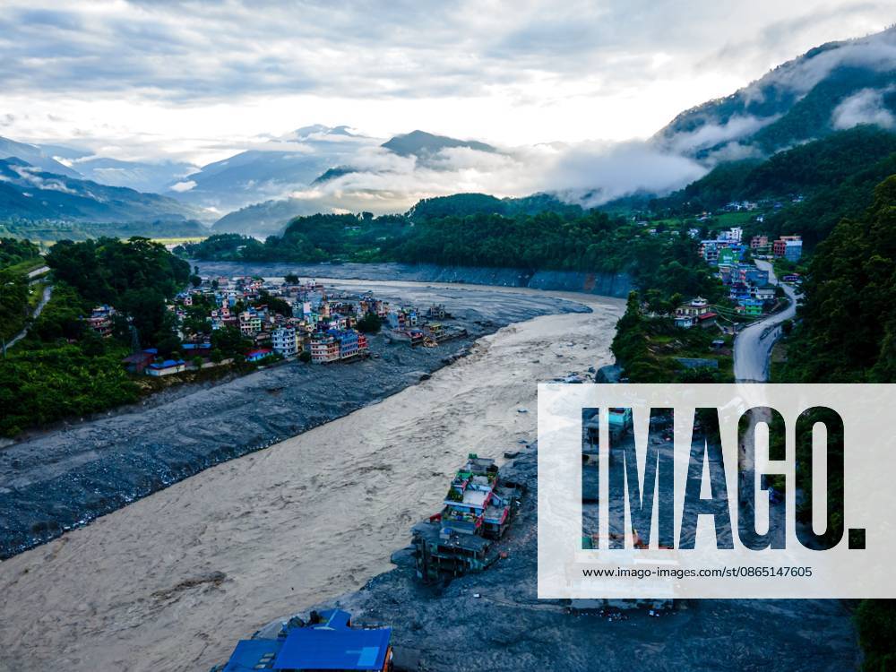 NUWAKOT, NEPAL Ã¢â‚¬ AUGUST 28, 2026: An aerial view shows the aftermath of severe flooding along the Bhotekoshi River in Nuwakot, Nepal. The flooding affected low-lying areas and settlements near the riverbanks, causing widespread damage to homes, roads, bridges, a hydropower station and other infrastructure. Several people remain missing as authorities continue to assess the extent of the disaster. Rescue teams and security personnel are conducting search and rescue operations in the affected areas. Nuwakot Nepal - ZUMAq101 20260828_zna_q101_130