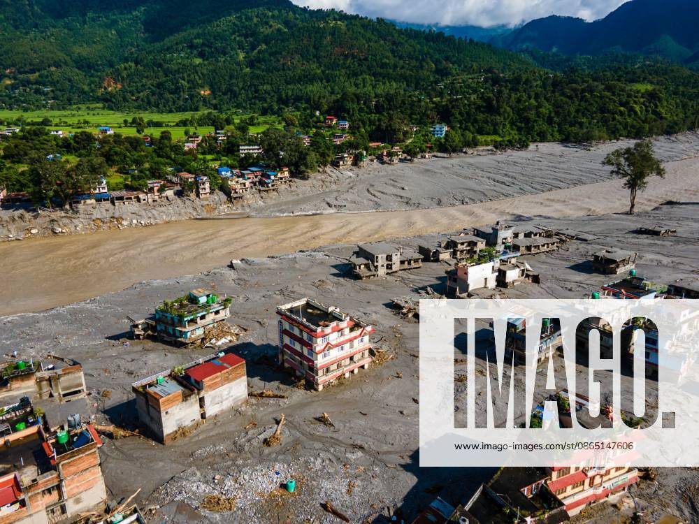 NUWAKOT, NEPAL Ã¢â‚¬ AUGUST 28, 2026: An aerial view shows the aftermath of severe flooding along the Bhotekoshi River in Nuwakot, Nepal. The flooding affected low-lying areas and settlements near the riverbanks, causing widespread damage to homes, roads, bridges, a hydropower station and other infrastructure. Several people remain missing as authorities continue to assess the extent of the disaster. Rescue teams and security personnel are conducting search and rescue operations in the affected areas. Nuwakot Nepal - ZUMAq101 20260828_zna_q101_131