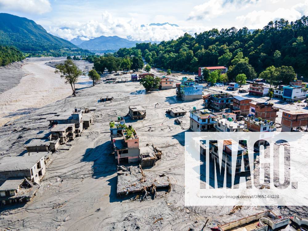 NUWAKOT, NEPAL Ã¢â‚¬ AUGUST 28, 2026: An aerial view shows the aftermath of severe flooding along the Bhotekoshi River in Nuwakot, Nepal. The flooding affected low-lying areas and settlements near the riverbanks, causing widespread damage to homes, roads, bridges, a hydropower station and other infrastructure. Several people remain missing as authorities continue to assess the extent of the disaster. Rescue teams and security personnel are conducting search and rescue operations in the affected areas. Nuwakot Nepal - ZUMAq101 20260828_zna_q101_125