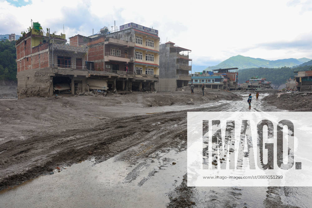 Nepal-China flash flood death toll rises to at least 469, hundreds remain missing NUWAKOT, NEPAL - AUGUST 28: People walk in the midst of collapsed and damaged houses covered in muds, following landslide and flash floods in areas near the Nepal-China border, in Nuwakot, Nepal, on August 28, 2026. Death toll from the disaster has so far risen to at least 469, with hundreds of people missing, including foreign nationals from 32 countries such as China, Malaysia, South Korea, Australia, the United Kingdom, India and the United States. Daniel Ceng Anadolu Nuwakot Nepal. Editorial use only. Please get in touch for any other usage.
