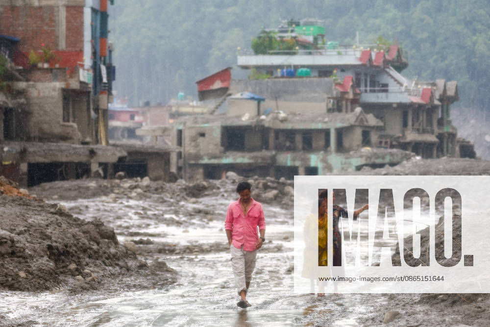 Nepal-China flash flood death toll rises to at least 469, hundreds remain missing NUWAKOT, NEPAL - AUGUST 28: Residents walk in the midst of muds and debris of collapsed houses, following landslide and flash floods in areas near the Nepal-China border, in Nuwakot, Nepal, on August 28, 2026. Death toll from the disaster has so far risen to at least 469, with hundreds of people missing, including foreign nationals from 32 countries such as China, Malaysia, South Korea, Australia, the United Kingdom, India and the United States. Daniel Ceng Anadolu Nuwakot Nepal. Editorial use only. Please get in touch for any other usage.