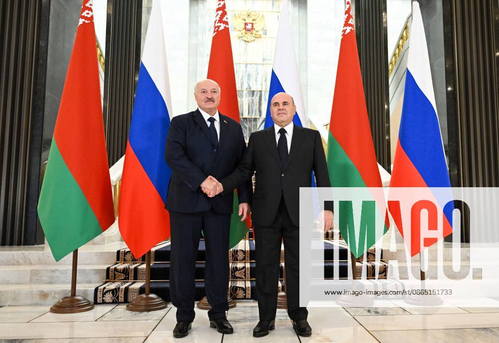 Russia Belarus 9230556 28.08.2026 Russian Prime Minister Mikhail Mishustin and Belarusian President Alexander Lukashenko, left, shake hands as they pose for photos during a meeting, in Moscow, Russia. Alexander Miridonov Sputnik Moscow Russia