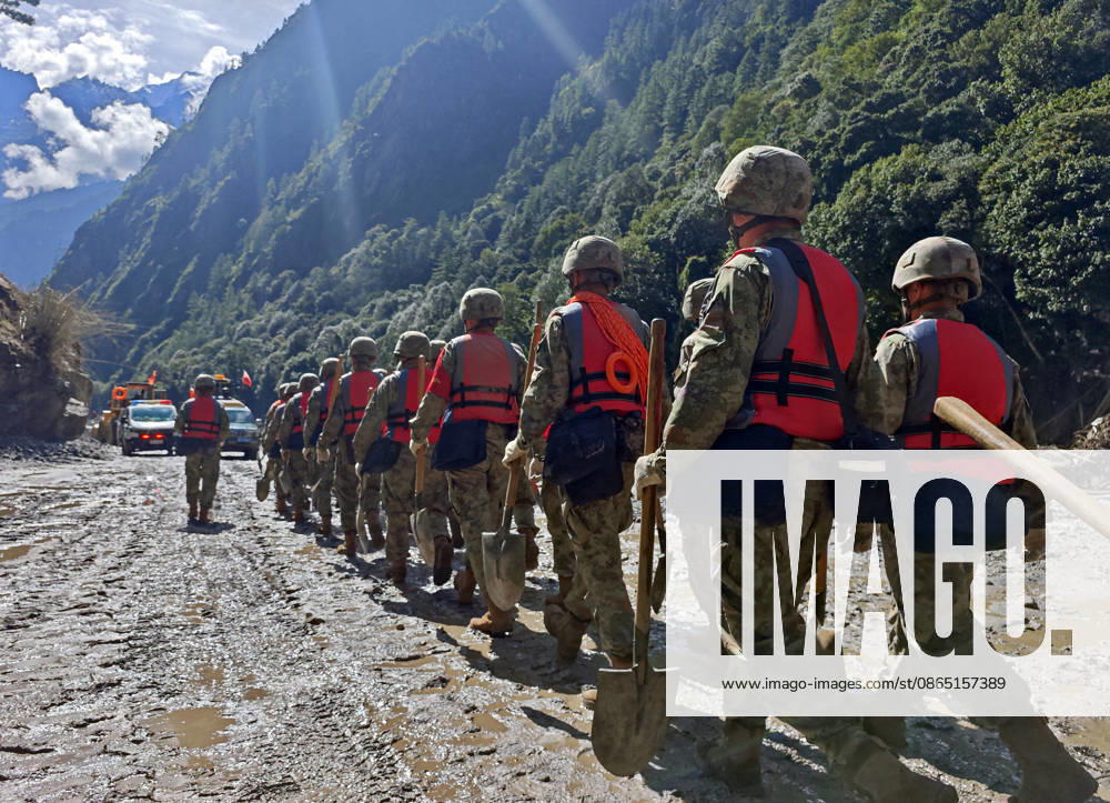 (260828) -- GYIRONG, Aug. 28, 2026 -- Rescuers from the Chinese People s Liberation Army are pictured on their way to the mudslide-hit area near Gyirong Port in Gyirong County, in Xigaze, southwest China s Xizang Autonomous Region, Aug. 28, 2026. The death toll had risen to five and 558 remained missing as of 3 p.m. on Friday after a mudslide struck the Gyirong Port along the China-Nepal border in southwest China s Xizang Autonomous Region, according to the region s emergency management department. Rescuers are operating around the clock in mudslide-affected areas near the Gyirong Port. (Photo by Zheng Chongxi Xinhua) (SpotNews) CHINA-XIZANG-XIGAZE-MUDSLIDE-RESCUE (CN) LiuxFang