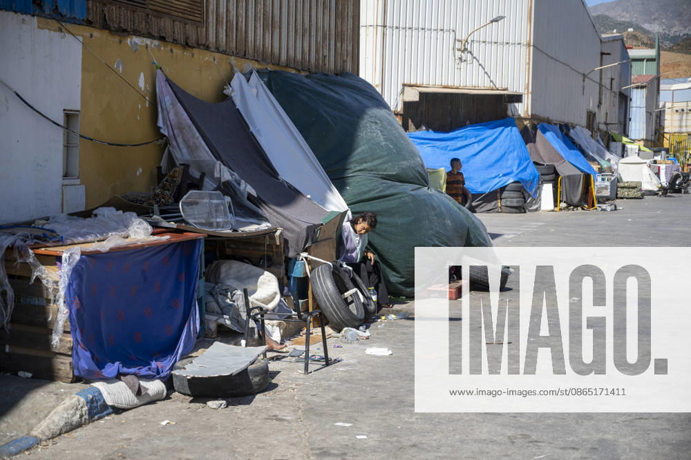 Day-to-Day Life of Migrants in the El Tarajal Industrial Park A person rests in a makeshift shelter in the El Tarajal Industrial Park on August 28, 2026, in Ceuta, Spain. Ceuta has announced plans to renovate the six industrial warehouses in the El Tarajal industrial park to transform them into a reception center. The project includes the installation of restrooms, kitchens, bedrooms, and other facilities. Depending on the condition of each warehouse, the project will also require the replacement of roofs, painting, and other repairs. AUGUST 28, 2026 MIGRATION CRISIS Ceuta, Spain