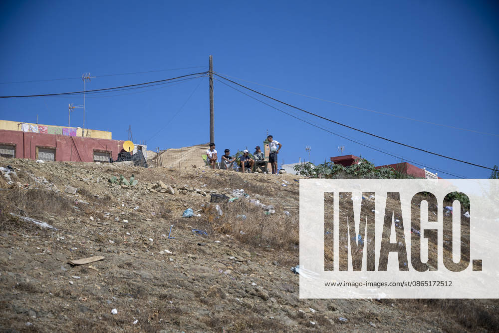 Daily Life of Migrants in the El Tarajal Industrial Park: Several people in the El Tarajal Industrial Park, on August 28, 2026, in Ceuta, Spain. Ceuta has announced plans to renovate the six industrial warehouses in the El Tarajal industrial park in order to transform them into a reception center. The project includes the installation of restrooms, kitchens, bedrooms, and other facilities. Depending on the condition of each warehouse, the project will also require the replacement of roofs, painting, and other repairs. AUGUST 28, 2026 MIGRATION CRISIS Ceuta, Spain