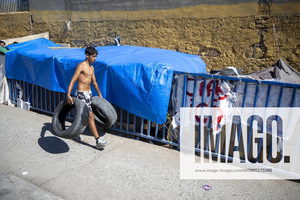Daily Life for Migrants at the El Tarajal Industrial Park A person at the El Tarajal Industrial Park on August 28, 2026, in Ceuta, Spain. Ceuta has announced plans to renovate the six industrial buildings in the El Tarajal industrial park to transform them into a reception center. The project includes the installation of restrooms, kitchens, bedrooms, and other facilities. Depending on the condition of each building, the project will also require the replacement of roofing, painting, and other repairs. AUGUST 28, 2026 MIGRATION CRISIS Ceuta, Spain