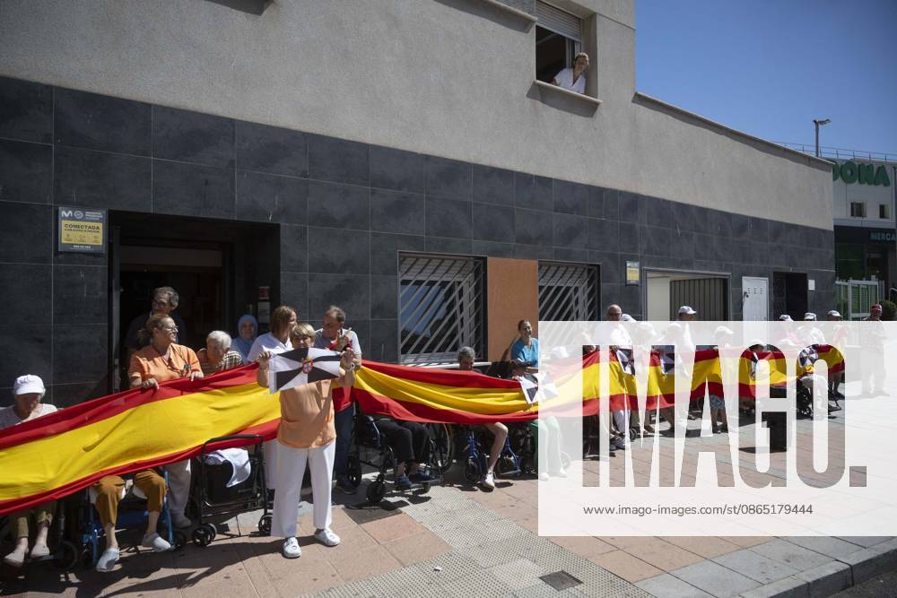Residents of a social and health care center in Ceuta denounce the lack of safety on the streets. Patients and staff hold up a Spanish flag during a demonstration to denounce the lack of safety on the streets, on August 28, 2026, in Ceuta, Spain. Staff members and patients at the Casa Familiar Nuestra Senora de los Ángeles hold a rally outside the facility to protest the growing lack of safety on the streets caused by the massive influx of migrants. AUGUST 28, 2026. MIGRATION CRISIS. Ceuta Ceuta, Spain