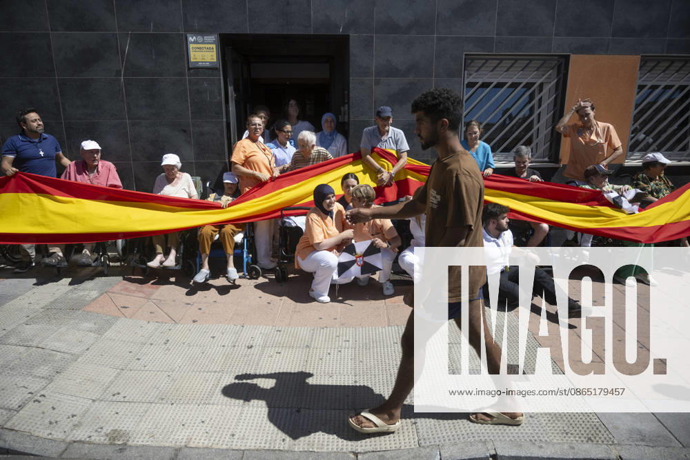 Residents of a social and health care center in Ceuta denounce the lack of safety on the streets. Patients and staff hold up a Spanish flag during a demonstration to denounce the lack of safety on the streets, on August 28, 2026, in Ceuta, Spain. Staff members and patients at the Casa Familiar Nuestra Senora de los Ángeles hold a rally outside the facility to protest the growing lack of safety on the streets caused by the massive influx of migrants. AUGUST 28, 2026. MIGRATION CRISIS. Ceuta Ceuta, Spain