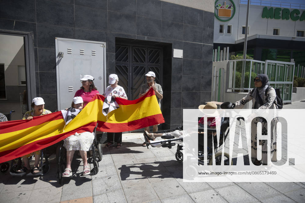 Residents of a social and health care center in Ceuta denounce the lack of safety on the streets. Patients and staff hold up a Spanish flag during a demonstration to denounce the lack of safety on the streets, on August 28, 2026, in Ceuta, Spain. Staff members and patients at the Casa Familiar Nuestra Senora de los Ángeles hold a rally outside the facility to protest the growing lack of safety on the streets caused by the massive influx of migrants. AUGUST 28, 2026. MIGRATION CRISIS. Ceuta Ceuta, Spain