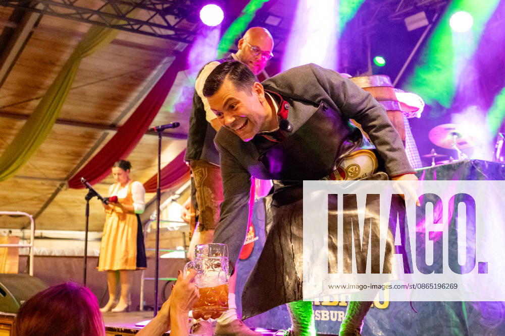 Augsburg, Bavaria, Germany August 28, 2026: Opening of the Plärrer in Augsburg. After tapping the first keg at the Herbstplärrer, Augsburgs mayor, Dr. Florian Freund (SPD), traditionally hands out free beer to visitors in the festival tent, thereby kicking off the evenings festivities.