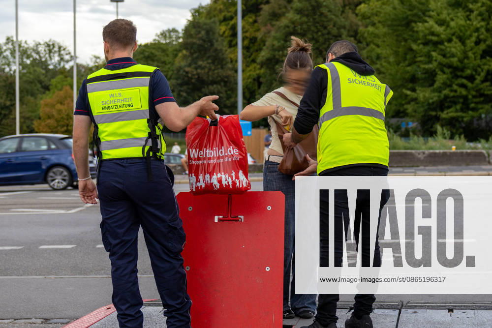 Opening of the Plärrer in Augsburg. A security guard checks a visitor s bag at the entrance to the Augsburg Herbstplärrer. The admission check is intended to ensure the safety of guests at the folk festival