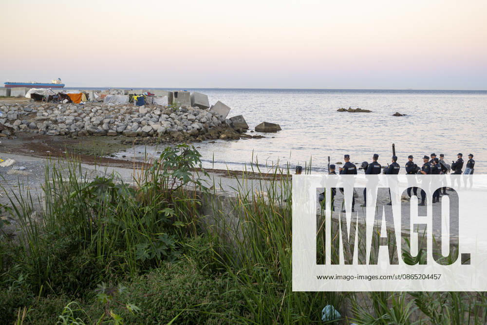 Trampolín Beach once again looks the same as it did during the early days of the mass arrival of migrants. Police patrol Trampolín Beach on August 28, 2026, in Ceuta, Spain. Hundreds of undocumented migrants remain in the Trampolín Beach area, where they have once again built shacks. AUGUST 28, 2026 MIGRATION CRISIS Ceuta, Spain