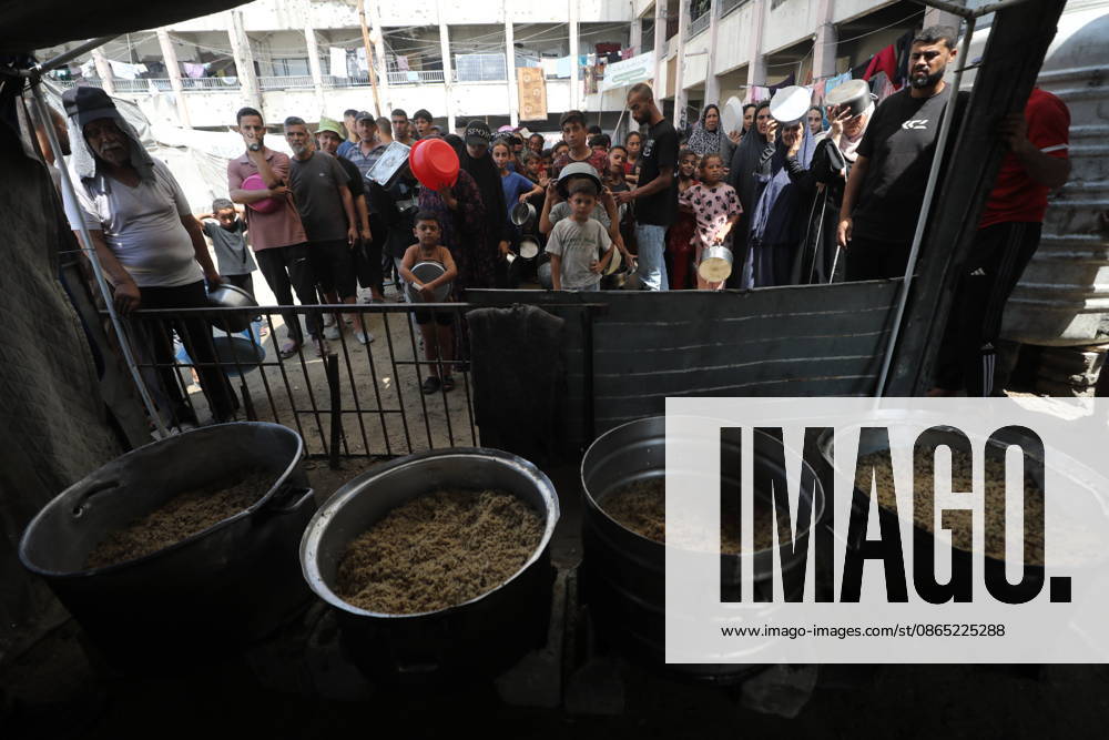 Displaced Palestinians Gather for Food Aid in Northern Gaza Displaced Palestinians carrying pots and containers gather to receive food from a charity kitchen in the northern Gaza Strip on August 29, 2026. Residents continue to face difficult humanitarian conditions and severe shortages of basic necessities amid the ongoing war and its widespread impact on daily life. Photo by Hassan al-Jedi apaimages Nusairat Gaza Strip Palestinian Territory 290826_Gaza_HJ_00(16).jpeg