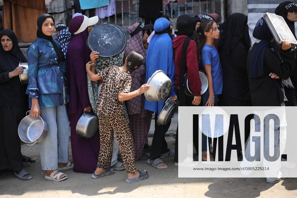 Displaced Palestinians Gather for Food Aid in Northern Gaza Displaced Palestinians carrying pots and containers gather to receive food from a charity kitchen in the northern Gaza Strip on August 29, 2026. Residents continue to face difficult humanitarian conditions and severe shortages of basic necessities amid the ongoing war and its widespread impact on daily life. Photo by Hassan al-Jedi apaimages Nusairat Gaza Strip Palestinian Territory 290826_Gaza_HJ_00(4).jpeg