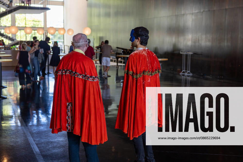 Costume Parade at the Deutsche Oper Berlin, Germany, Berlin, August 29, 2026. With the slogan Unless the People Live Here, the Deutsche Oper Berlin kicked off its new season. Numerous visitors dressed up in costumes from the opera’s wardrobe. Two men wearing masks and red capes in the foyer of the Deutsche Oper Berlin