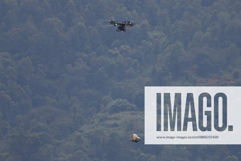 A drone carrying food and essential supplies flies over flood-affected areas as rescue and relief efforts continue following devastating flash floods and mudslides at Devighat in Bidur Municipality, Nuwakot district. The disaster, triggered by a glacial collapse and massive debris flow upstream, devastated communities along the Trishuli River, leaving hundreds dead and many others missing. Nuwakot Nepal - ZUMAs197 20260830_aaa_s197_003