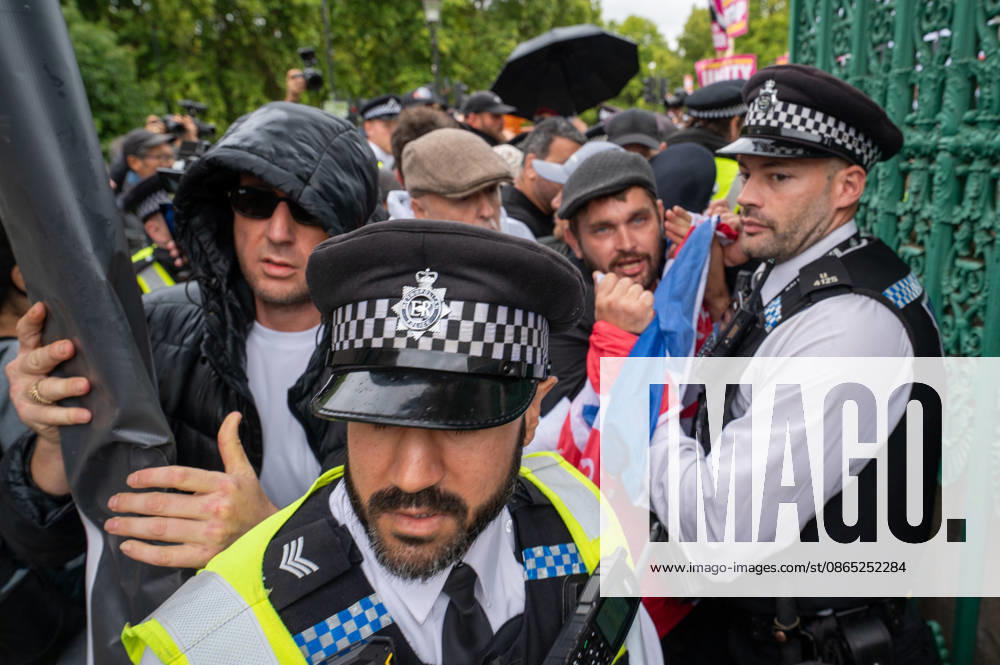 UKIP supporters and police officers confront one another during the No to Sharia Law march and rally in central London. UKIP leader Nick Tenconi led supporters on a march and rally through central London calling for an end to Sharia law in Great Britain. The demonstration, organized under the banner No to Sharia Law, was met by a counter-protest. Tensions rose at the start of the march, with counter-protesters pushing against police officers as officers attempted to keep the opposing groups apart. The Metropolitan Police had imposed conditions on both demonstrations to prevent serious disorder. London United Kingdom - ZUMAs197 20260829_aaa_s197_165