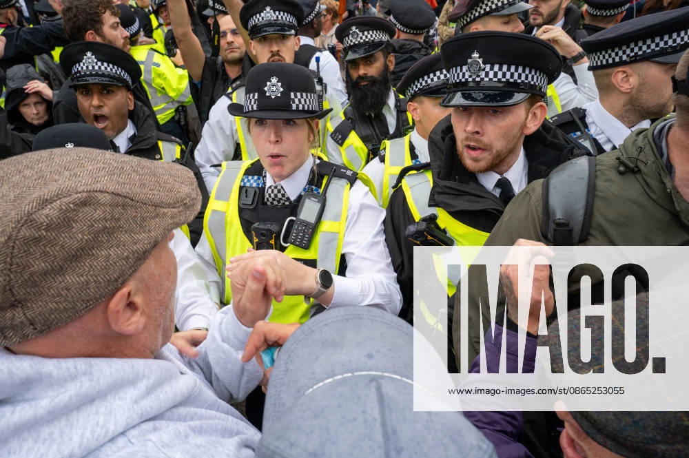 UKIP supporters and police officers confront one another during the No to Sharia Law march and rally in central London. UKIP leader Nick Tenconi led supporters on a march and rally through central London calling for an end to Sharia law in Great Britain. The demonstration, organized under the banner No to Sharia Law, was met by a counter-protest. Tensions rose at the start of the march, with counter-protesters pushing against police officers as officers attempted to keep the opposing groups apart. The Metropolitan Police had imposed conditions on both demonstrations to prevent serious disorder. London United Kingdom - ZUMAs197 20260829_aaa_s197_178