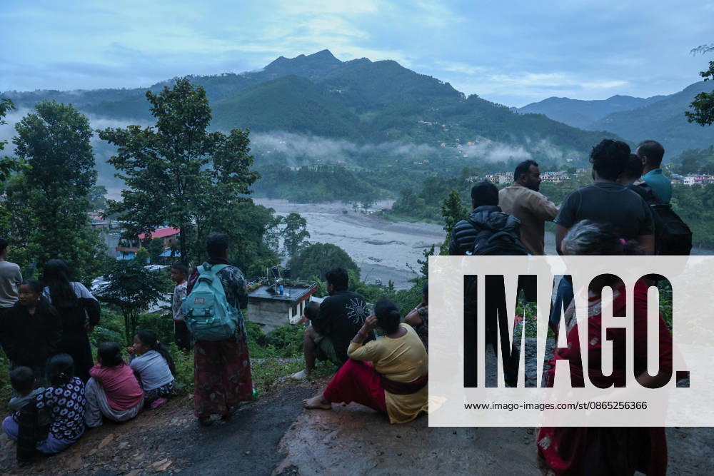 People in Nepal flee homes amid flash flood warning BIDUR, NEPAL - AUGUST 30: Residents living along Trishuli River take shelter at higher ground after fleeing homes early in the morning, as authorities issue new flash flood warning, in Bidir, Nuwakot, Nepal, on August 30, 2026. More than 2,000 people remain missing while hundreds of people have died, following the flash flood and landslide near the Nepal-China border earlier. Among the missing foreign nationals include those from China, India, the United States, Australia, the United Kingdom and South Korea. Daniel Ceng Anadolu Bidur Nepal. Editorial use only. Please get in touch for any other usage.