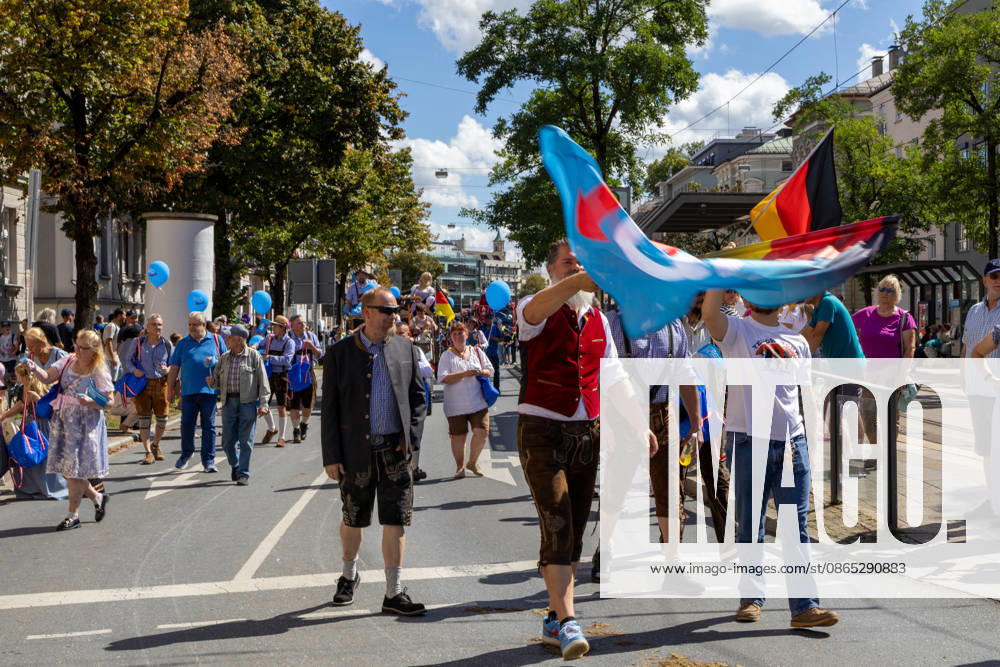 Traditional Plärrer parade in Augsburg. Members of the AfD (Alternative for Germany) take part in the traditional Plärrer parade through Augsburg, carrying party banners and German flags, and march through the city alongside other groups