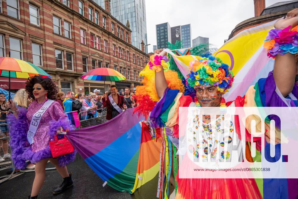 Pride umbrellas and flags seen during the pride parade. Revelers refused to let a heavy downpour dampen their spirits as the annual parade makes its way through the city centre. Despite the torrential rain, the LGBTQ+ community and supporters partied anyway, filling the streets with vibrant colour, music, and joy. The festival has been officially renamed Manchester Village Pride this year, marking a new community-led chapter after the voluntary liquidation and financial collapse of the former organizing company last autumn. Taking part in the celebrations, the newly elected Mayor of Greater Manchester, Bev Craig, actively engaged with parade participants and cheering crowds along the route throug - ZUMAs197 20260829_aaa_s197_354