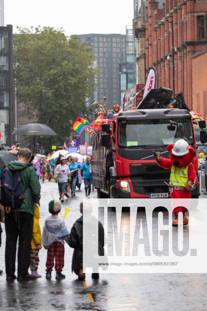 A family await the fireman pride group during the pride parade. Revelers refused to let a heavy downpour dampen their spirits as the annual parade makes its way through the city centre. Despite the torrential rain, the LGBTQ+ community and supporters partied anyway, filling the streets with vibrant colour, music, and joy. The festival has been officially renamed Manchester Village Pride this year, marking a new community-led chapter after the voluntary liquidation and financial collapse of the former organizing company last autumn. Taking part in the celebrations, the newly elected Mayor of Greater Manchester, Bev Craig, actively engaged with parade participants and cheering crowds along the rout - ZUMAs197 20260829_aaa_s197_376