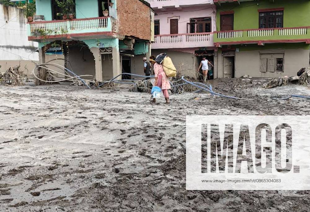 (260830) -- NUWAKOT, Aug. 30, 2026 -- Mudslide-affected residents transport their belongings in Devighat in Nuwakot, Nepal, Aug. 29, 2026. As of 9 a.m. local time on Sunday, 734 bodies had been recovered from mudslide-hit areas, with 2,498 people still missing, according to Nepal s National Disaster Risk Reduction and Management Authority. ) NEPAL-NUWAKOT-MUDSLIDE-AFTERMATH LiuxTian