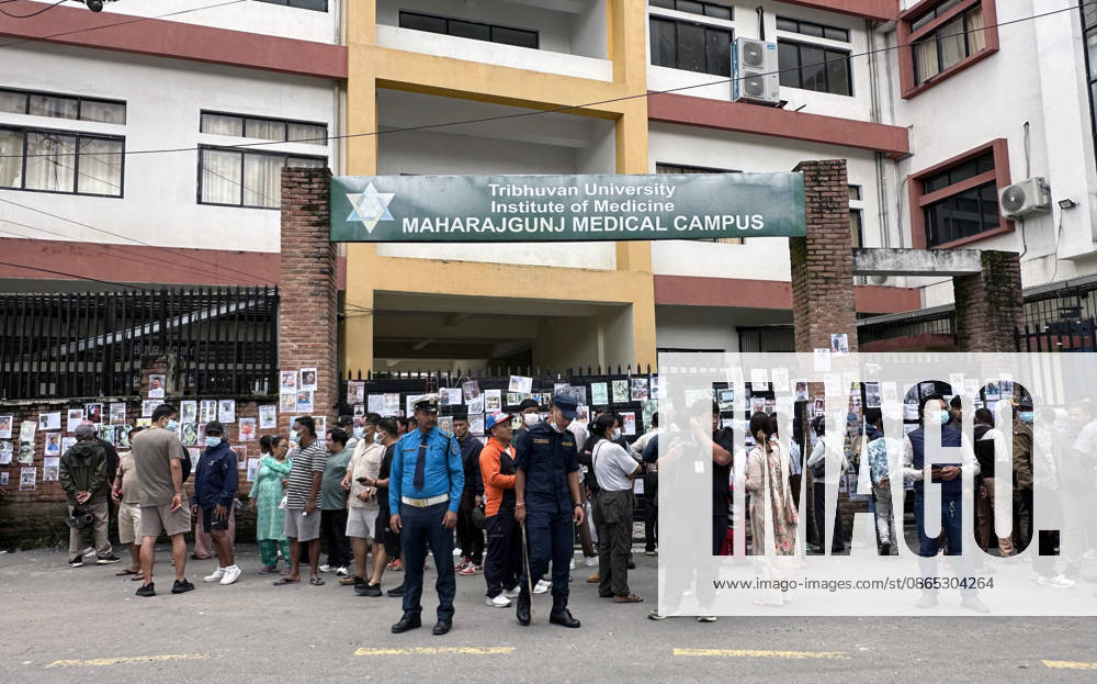 Family members gather outside a hospital to check photographs of missing people as they await information about their loved ones at Tribhuvan University Teaching Hospital in Maharajgunj, Kathmandu,Nepal on August 30, 2026. Recovered bodies are being kept at the hospital for identification and post-mortem examinations following the devastating floods in Rasuwa.According to authorities, 734 people had died and 2,498 remained missing as morning of Aug. 30, 2026, following devastating flash floods that struck areas near the Nepal-China border on Aug. 26. Kathmandu Nepal - ZUMAs233 20260830_zap_s233_004