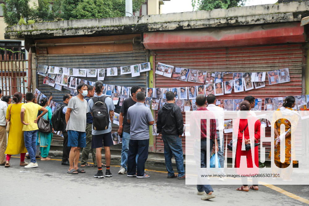 Passersby View Flood Victims Photos - Kathmandu Passersby look at photographs of people who died in the floods, displayed outside a hospital in Kathmandu, Nepal on August 30, 2026. Photo by Sunil Pradhan ABACAPRESS.COM Kathmandu Bagmati Nepal