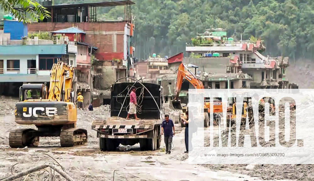 Heavy Machinery Clears Mud and Debris from Flood-Damaged Residential Area in Nuwakot Nuwakot Nepal , Aug 30 (ANI): Heavy machinery, including excavators and trucks, clears thick mud and debris from a residential area damaged by a devastating flood, as people assess the site amid ongoing cleanup operations at Trishuli, in Nuwakot on Sunday. (ANI Video Grab) Nuwakot Nepal