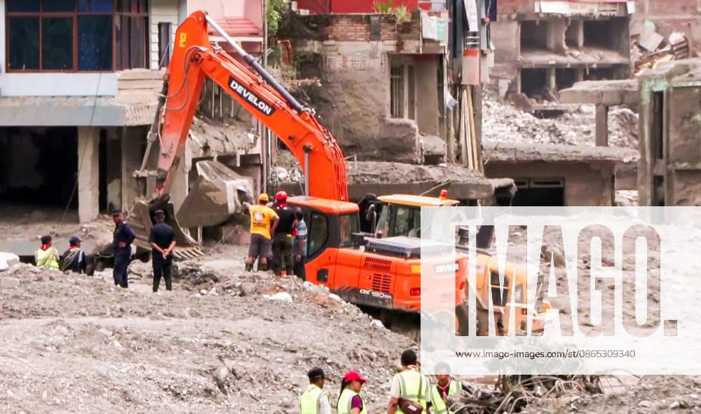 Debris Clearance Underway in Flood-Damaged Residential Area in Nuwakot Nuwakot Nepal , Aug 30 (ANI): An excavator clears debris from around damaged multi-storey buildings as workers oversee the operation in the aftermath of a devastating flood at Trishuli, in Nuwakot on Sunday. (ANI Video Grab) Nuwakot Nepal