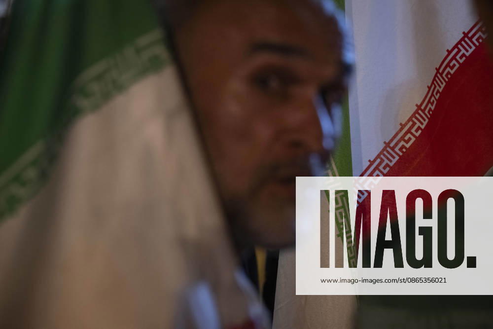 Nightly Pro-Government Rally In Tehran, Iran A pro-government supporter holds an Iranian national flag during a nightly rally in downtown Tehran, Iran, on August 30, 2026. U.S. forces struck two Iranian military launchers on Larak Island in the Strait of Hormuz on August 30, in the first reported U.S. attack on Iranian territory since late July. Tehran Tehran Iran