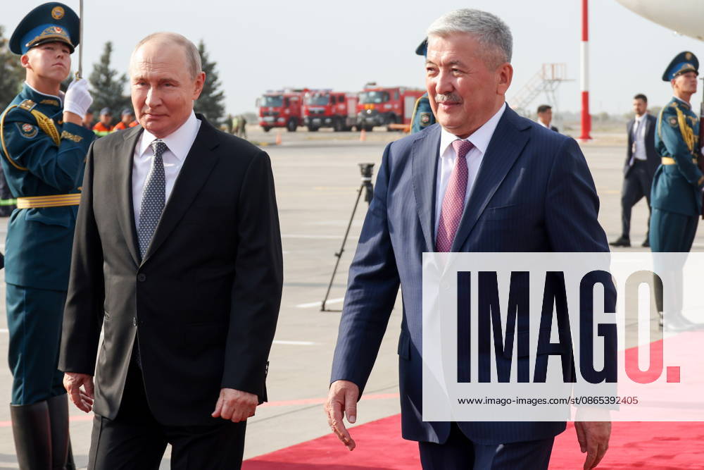 KYRGYZSTAN, BISHKEK - AUGUST 31, 2026: Russia’s President Vladimir Putin (L) and the Chairman of the Cabinet of Ministers of Kyrgyzstan Head of the Presidential Administration, Adylbek Kasymaliyev, are seen during a ceremony marking Putin s arrival at Manas International Airport. Konstantin Zavrazhin POOL TASS 96903983