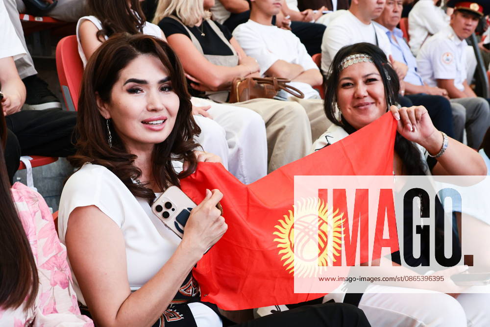 KYRGYZSTAN, BISHKEK - AUGUST 31, 2026: Members of the public with a Kyrgyz national flag at the opening ceremony of the 2026 World Nomad Games at Bishkek Arena Bishkek Kyrgyzstan - ZUMAt113 20260831_zaa_t113_176