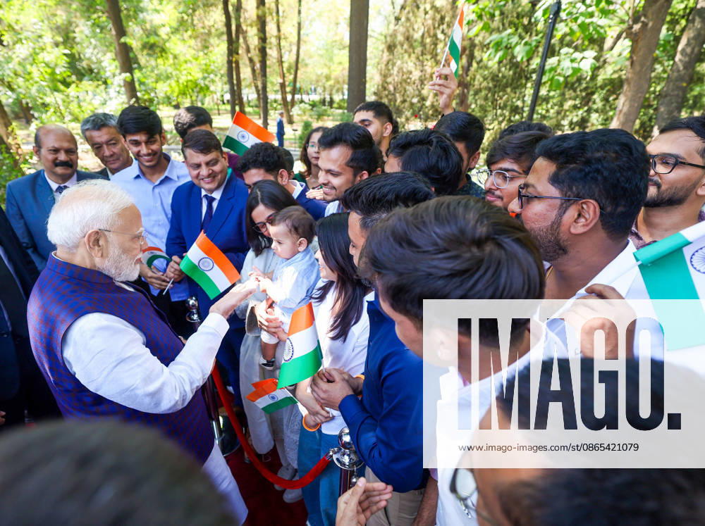 PM Modi Interacts with Child While Meeting Indian Diaspora in Bishkek Bishkek Kyrgyzstan , Aug 31 (ANI): Prime Minister Narendra Modi interacts with a child as he meets members of the Indian diaspora after paying tribute at the Mahatma Gandhi Memorial, in Bishkek on Monday. (Narendra Modi Photo Gallery ANI Photo) Bishkek Kyrgyzstan