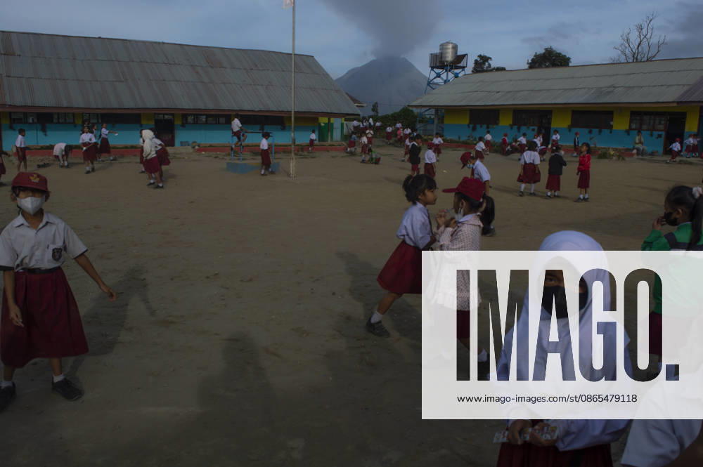 Sinabungs Renewed Ash Schoolchildren wear protective face masks while traveling to school in Gajah Village, Simpang Empat District, Karo Regency, North Sumatra, Indonesia, on September 1, 2026. The use of masks is a precautionary measure by local residents against airborne volcanic ash following renewed eruptive activity from Mount Sinabung on August 30, 2026. The volcano had previously been dormant for 400 years before entering a prolonged eruption period from 2010 until activity subsided in 2021. Karo, North Sumatra Indonesia