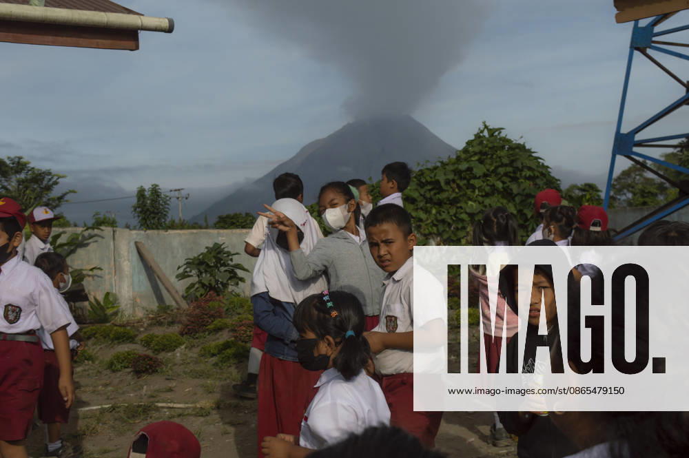 Sinabungs Renewed Ash Schoolchildren wear protective face masks while traveling to school in Gajah Village, Simpang Empat District, Karo Regency, North Sumatra, Indonesia, on September 1, 2026. The use of masks is a precautionary measure by local residents against airborne volcanic ash following renewed eruptive activity from Mount Sinabung on August 30, 2026. The volcano had previously been dormant for 400 years before entering a prolonged eruption period from 2010 until activity subsided in 2021. Karo, North Sumatra Indonesia