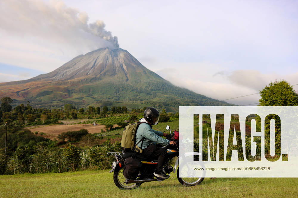 Volcanic activity continues at Mount Sinabung following massive eruption KARO, INDONESIA - SEPTEMBER 1: A man rides his motorbike as volcanic activity continues at Mount Sinabung as it spews volcanic material in Karo Regency, North Sumatra, Indonesia, on September 1, 2026. Following a massive eruption on August 31 that sent a thick column of volcanic ash approximately 3,500 meters (3.5 kilometers) above its summit, the ongoing ashfall and atmospheric disruptions led to the cancellation of 21 flights to and from Kualanamu International Airport. Risky Cahyadi Anadolu Karo Indonesia. Editorial use only. Please get in touch for any other usage.