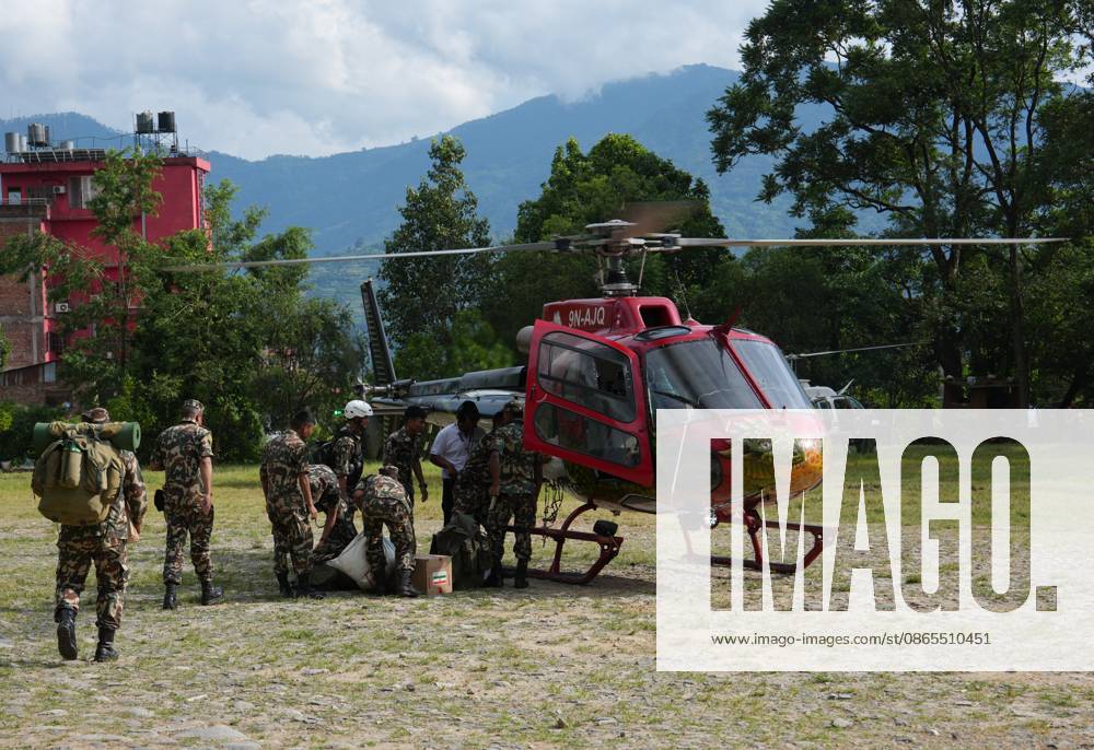 (260901) -- NUWAKOT, Sept. 1, 2026 -- Rescuers load supplies to a helicopter in Nuwakot, Nepal, Aug. 31, 2026. Nepalese authorities said Tuesday that the death toll from the massive mudslide had risen to 1,010, with 4,599 people still missing. ) NEPAL-NUWAKOT-MUDSLIDE-AFTERMATH LiuxTian