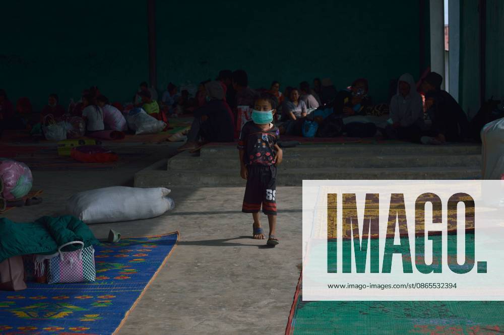 Karo, North Sumatra, ID: KARO, NORTH SUMATRA, INDONESIA, SEPTEMBER 1, 2026: Children stay with their families at a temporary shelter in a communal hall in Sukatepu Village, Karo Regency, following renewed volcanic activity at Mount Sinabung. Evacuated residents are receiving basic supplies, protective masks and health services as local authorities continue emergency relief operations. North Sumatra Governor Bobby Nasution visited the shelter to inspect relief efforts and the distribution of supplies. Karo, North Sumatra ID - ZUMAq101 20260901_zna_q101_107