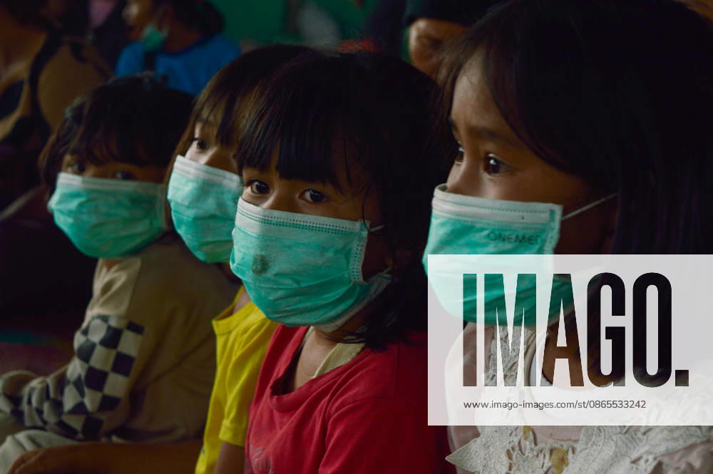 Residents Evacuate as Mount Sinabung Activity Intensifies - Indonesia Children are seen inside a temporary shelter at a communal hall in Sukatepu Village, Karo Regency, North Sumatra, Indonesia, on September 1, 2026, following renewed volcanic activity from Mount Sinabung. Displaced along with their families, these young evacuees receive basic supplies, face masks, and healthcare support as local authorities manage emergency relief efforts. Having experienced recurring eruptive phases, the communities remain vigilant while disaster management agencies update the dynamic hazard perimeters and evacuation routes across the region. The shelter operation was visited by North Sumatra Governor Bobby Nasution, who inspected the distribution of reli